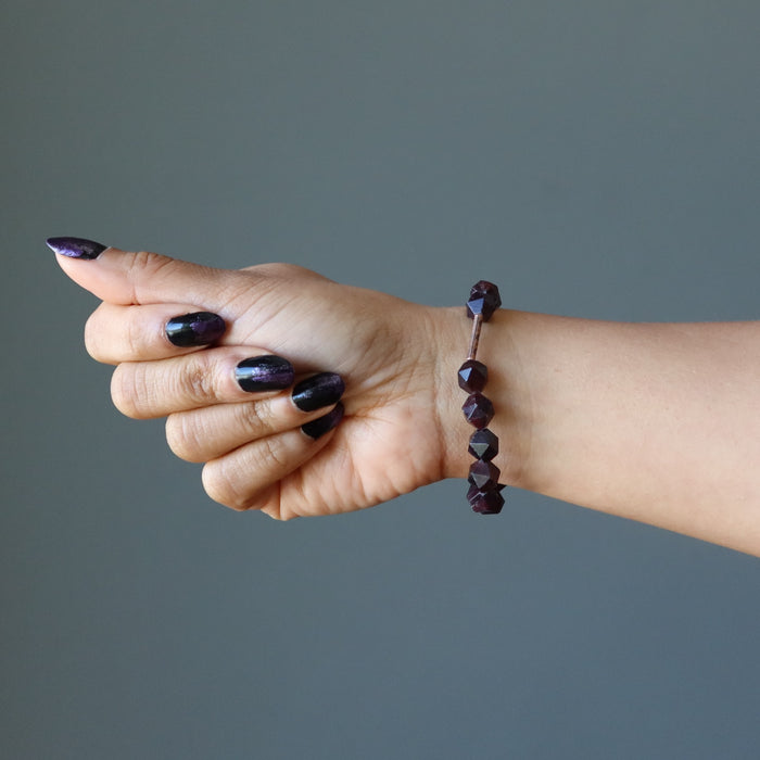 hand wearing a Faceted Garnet Bracelet