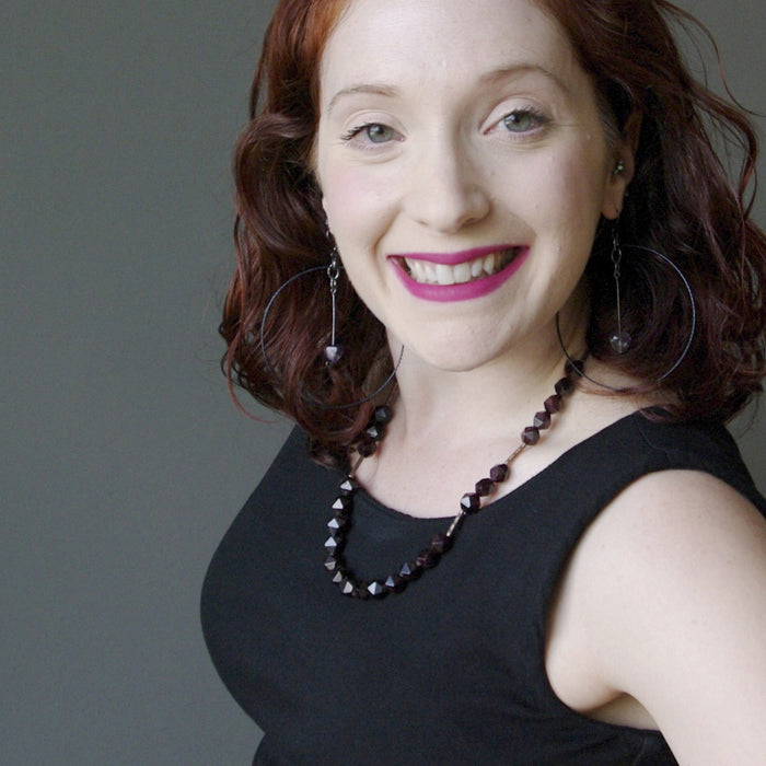 female model wearing  garnet necklace