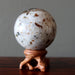 spessartine garnet sphere on ball stand