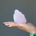 raw rose quartz in hand