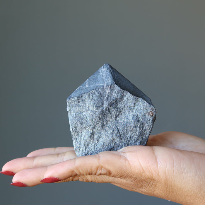 hand holding hematite tower