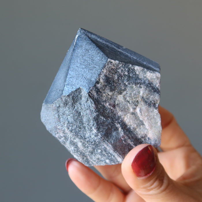 hand holding hematite tower