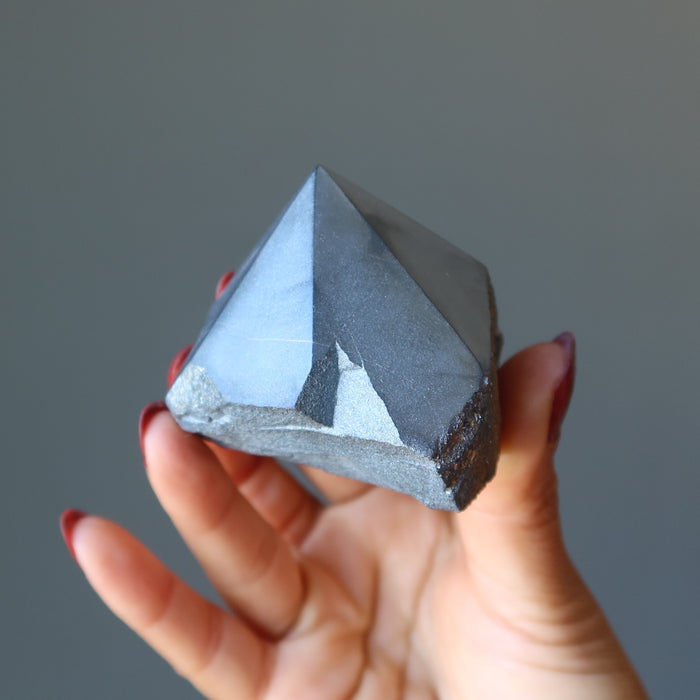 hand holding hematite tower