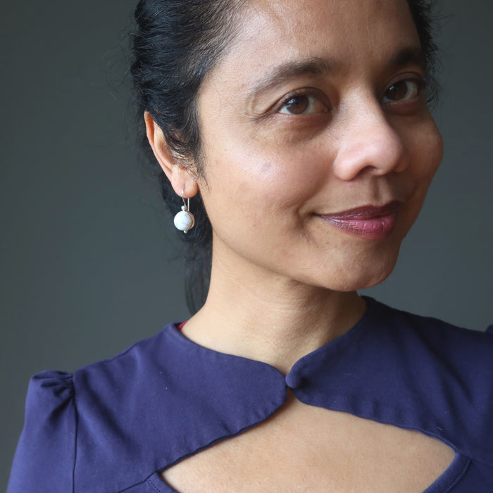 model wearing howlite sterling silver earrings