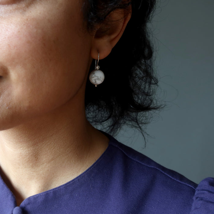 model wearing howlite sterling silver earrings