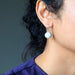 model wearing howlite sterling silver earrings