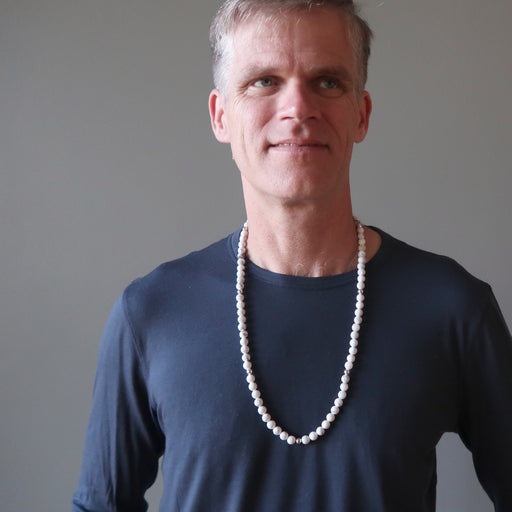 male model wearing long howlite beaded necklace