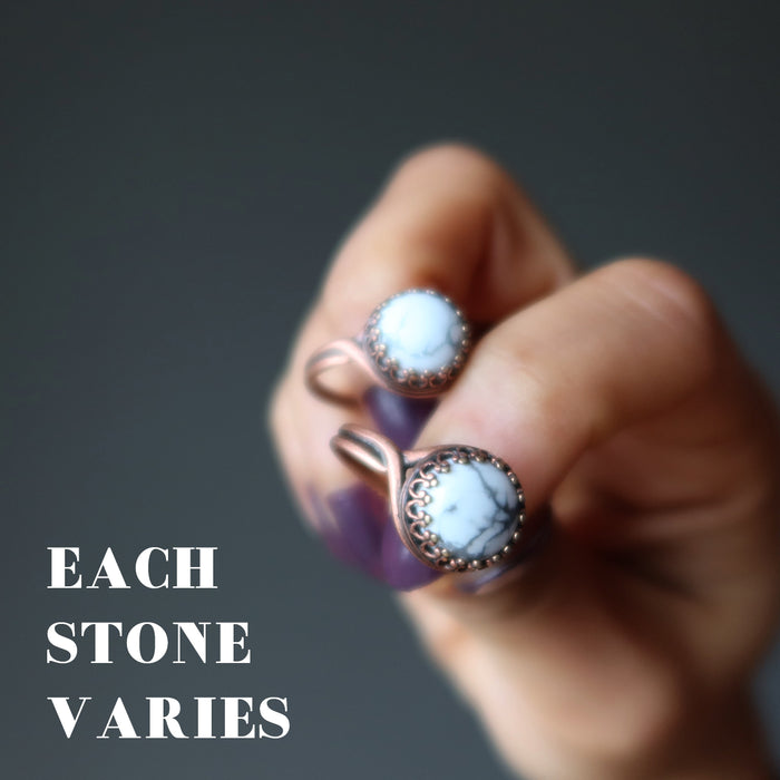 hand holding 2 howlite rings showing each stone varies