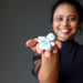 sheila of satin crystals holding white and gray howlite tumbled stones