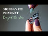 video featuring a moldavite pendant