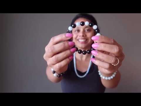 video on wearing blue aquamarine and black rainbow obsidian stretch bracelet