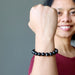 sheila of satin crystals with fist up wearing hypersthene bracelet