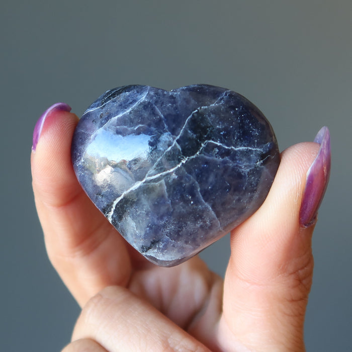hand holding iolite heart