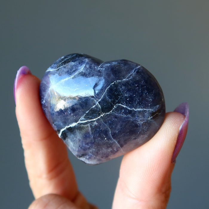 hand holding iolite heart