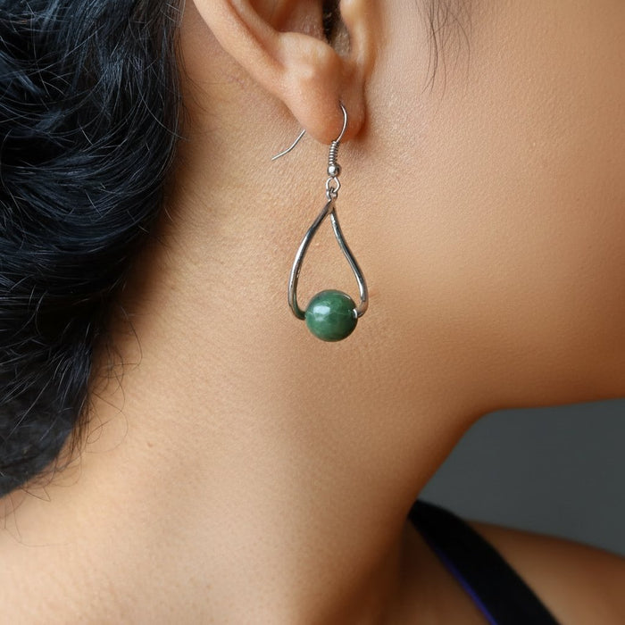 woman modeling jade earrings