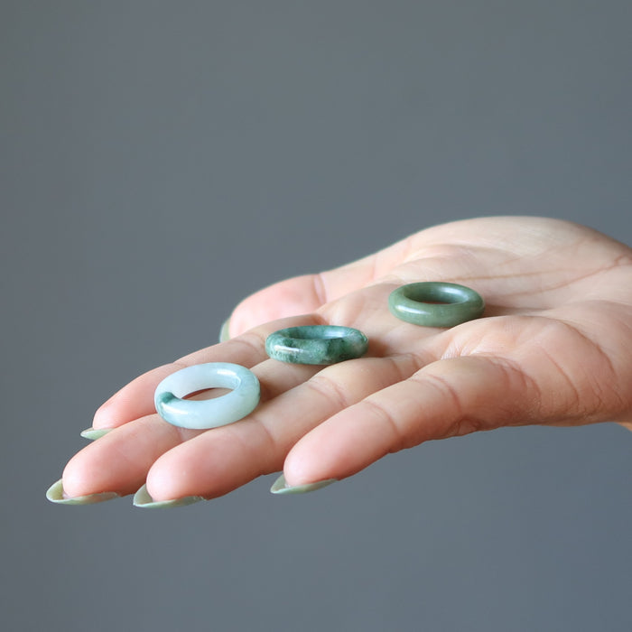 jade rings in palm of hand