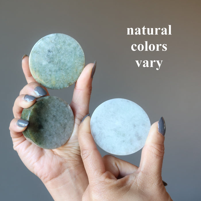 three jade circles in different colors