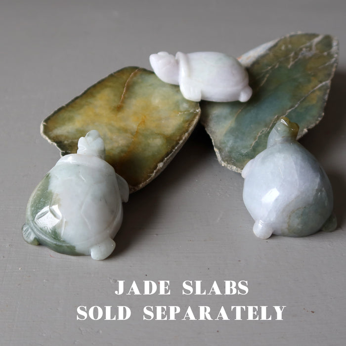three jade turtles on jade slabs