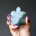 hand holding green jadeite jade turtle carving