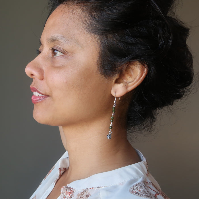 sheila of satin crystals modeling jade skull earrings