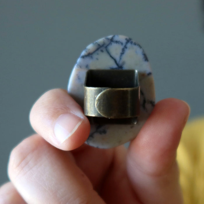 hand holding back of adjustable ring