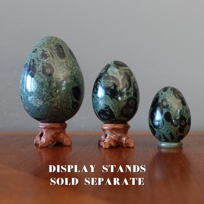 green jasper eggs on display stands