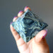 hand holding Kambaba Green Jasper Pyramid