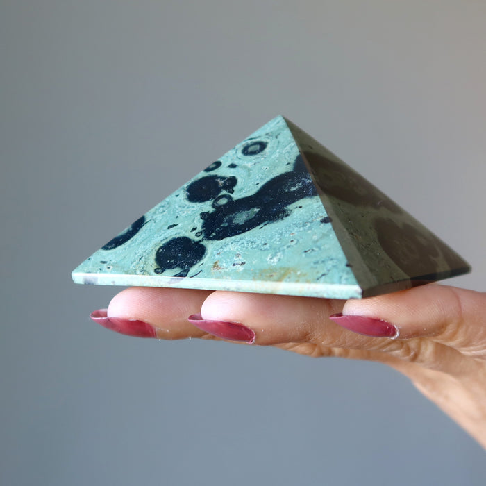 holding Kambaba Green Jasper Pyramid