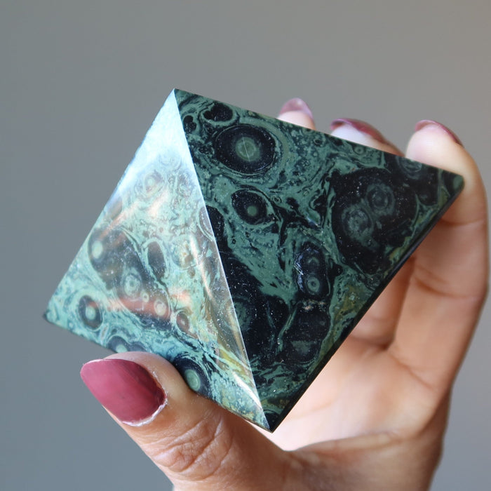 holding Kambaba Green Jasper Pyramid