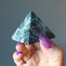 hand holding Kambaba Green Jasper Pyramid