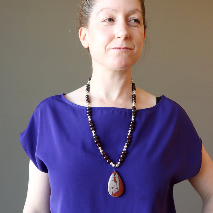 female wearing mookaite jasper and red garnet beaded necklace