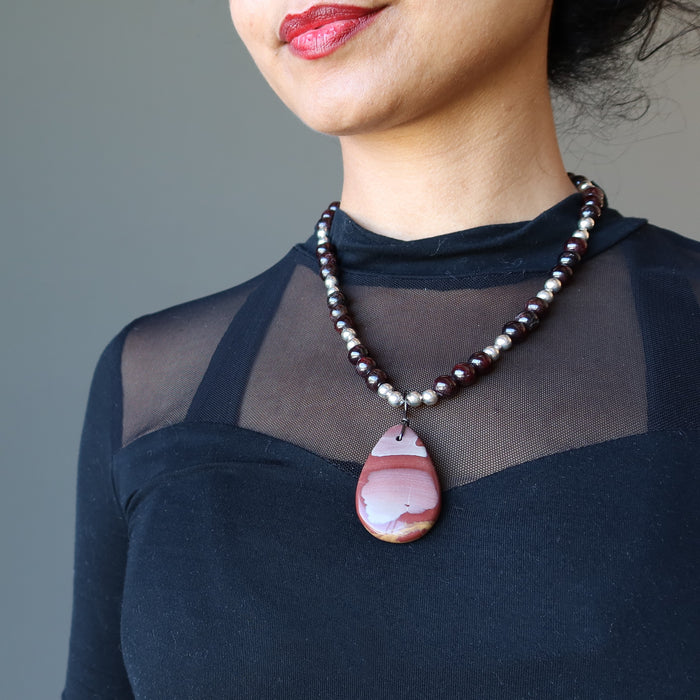 female wearing mookaite jasper and red garnet beaded necklace