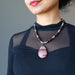 female wearing mookaite jasper and red garnet beaded necklace