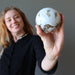 woman holding ocean jasper sphere