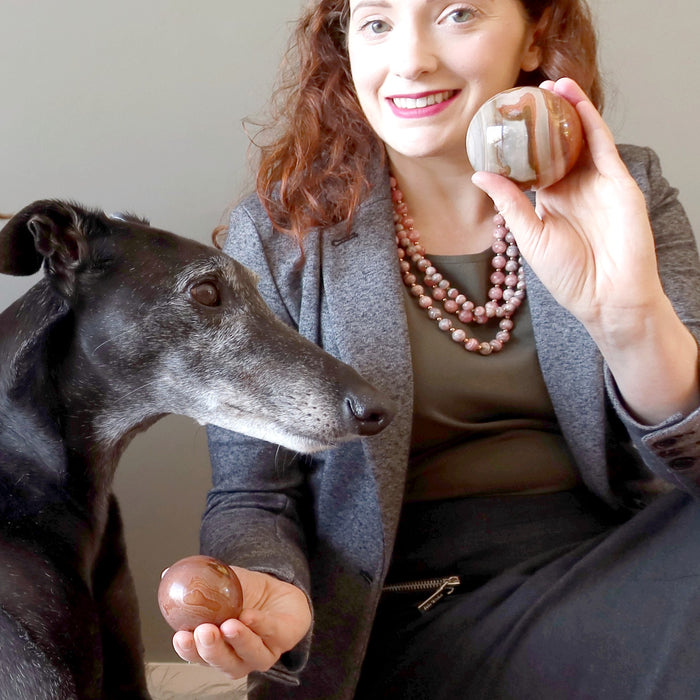 woman and dog with polychrome jasper spheres