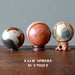 polychrome jasper spheres on wood stands