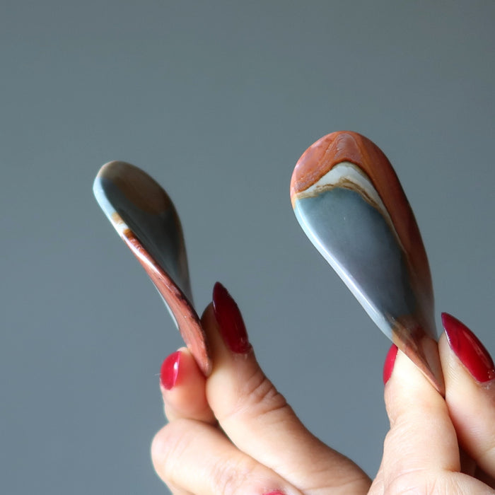 hand holding polychrome jasper crystals
