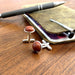 red jasper cufflinks on desk