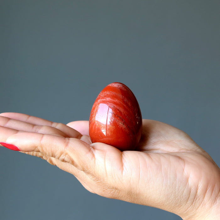 red jasper egg in hand