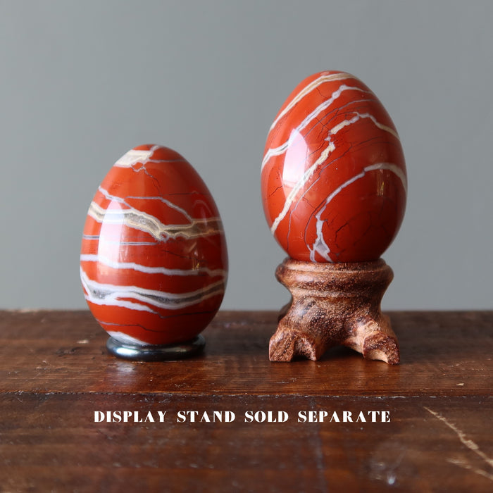 red jasper eggs on display stands