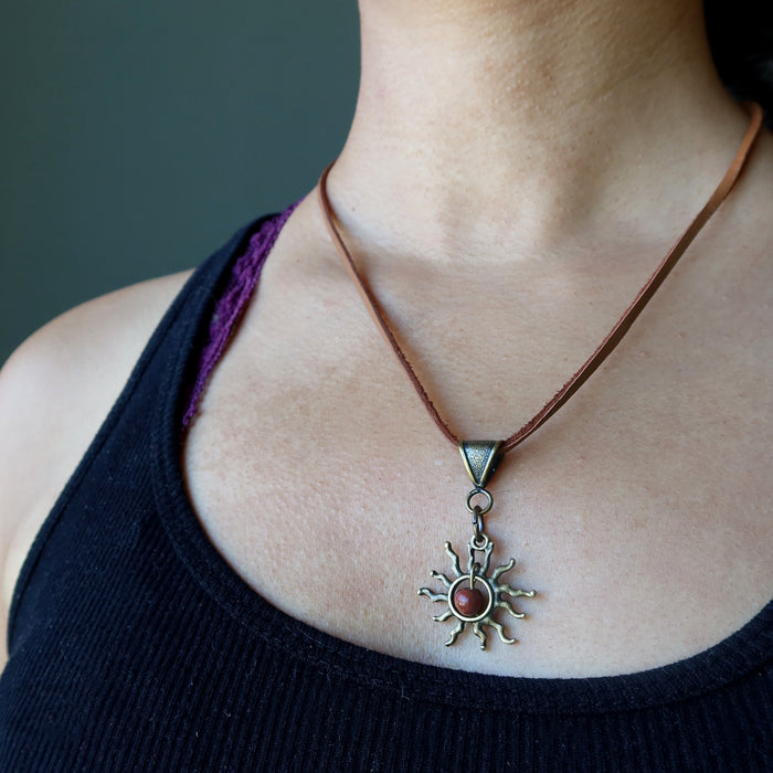 red jasper sun necklace on neck