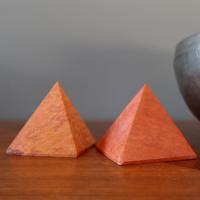 two red jasper pyramids