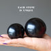 jet stone spheres in hand