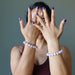 woman wearing two kunzite bracelets