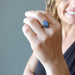 woman wearing blue kyanite oval in adjustable brass ring