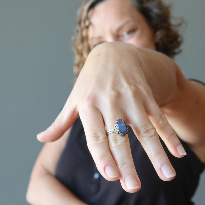 woman wearing blue kyanite oval in adjustable brass ring