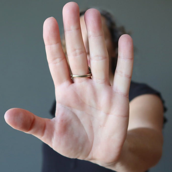 woman wearing blue kyanite oval in adjustable brass ring showing back