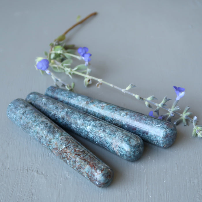 three blue kyanite massage wand and flowers