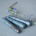 three blue kyanite massage wand and flowers