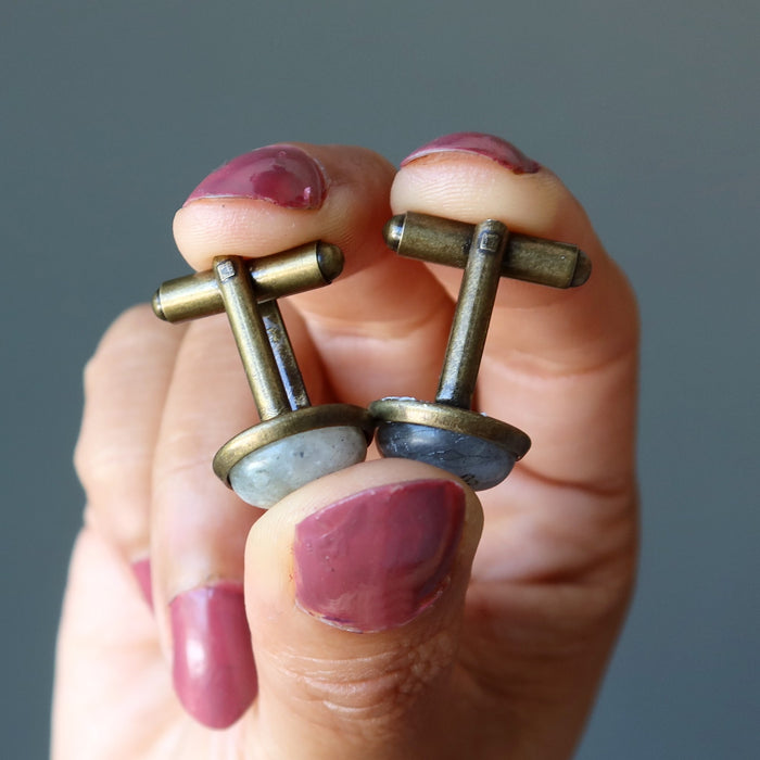 sheila of satin crystals holding labradorite cufflinks